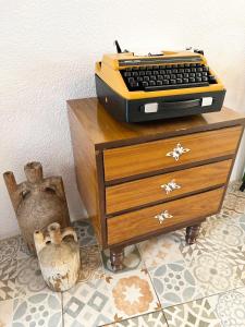 a desk with a keyboard on top of a dresser at Kaya Apart & Pansiyon in Bodrum City