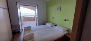 Postel nebo postele na pokoji v ubytování VeLun apartmani