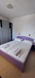 Postel nebo postele na pokoji v ubytování VeLun apartmani