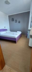Postel nebo postele na pokoji v ubytování VeLun apartmani
