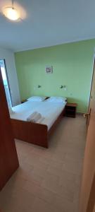 Postel nebo postele na pokoji v ubytování VeLun apartmani