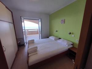 Postel nebo postele na pokoji v ubytování VeLun apartmani
