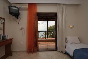 A bed or beds in a room at Panorama Spa Hotel