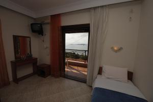 A bed or beds in a room at Panorama Spa Hotel