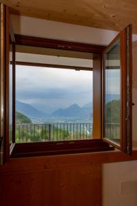 a window in a room with a view at Agritur Maso Rauter in Vattaro