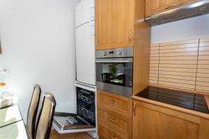 Kuchyňa alebo kuchynka v ubytovaní Sunbird Apartman Budapest
