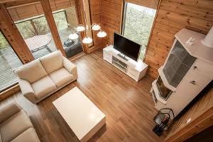 an overhead view of a living room in a log cabin at Saimaan Aarre in Tiuruniemi