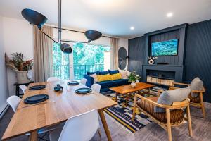 a living room with a table and a couch at Revelation Retreat by Revelstoke Vacations in Revelstoke