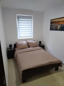 En eller flere senge i et værelse på Apartman "N" Srebrno jezero