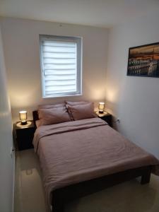 Krevet ili kreveti u jedinici u okviru objekta Apartman "N" Srebrno jezero