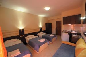 A bed or beds in a room at Panorama Spa Hotel