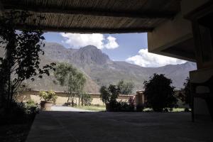 a building with a view of a mountain at Casafranca in Ollantaytambo