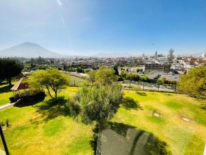 a green park with a city in the background at Exclusivo y amplio- Great View in Arequipa