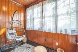 a rocking chair in a room with a window at Comfy pet friendly home in Jacksonville mins to downtown’s in Jacksonville +23 photos