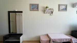 A bed or beds in a room at SUMMER BREEZE 406 Studio Sunny Beach