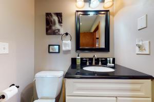 a bathroom with a sink and a toilet at New England Treasure in North Conway +72 photos