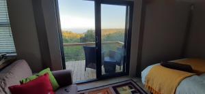 Ένα ή περισσότερα κρεβάτια σε δωμάτιο στο Oriole Serene Self Catering Studio