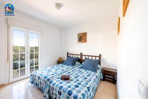 Ένα ή περισσότερα κρεβάτια σε δωμάτιο στο Apartamentos Madeira Casa Azahar