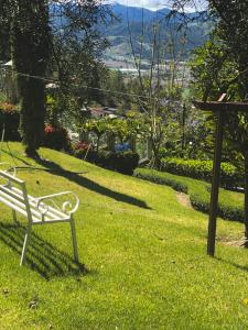 a park bench sitting in a field of grass at Villa paloma in Constanza