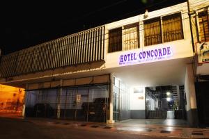 a building with a sign that reads liquid concrete at Hotel Concorde in Arica