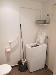 a washing machine in a bathroom with a mop at Cap Esterel face à la mer Agay St Raphael in Drammont +27 photos