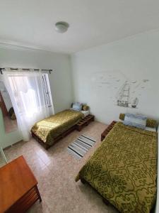 Una cama o camas en una habitación de Hostel Zabava