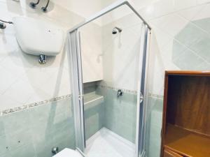 a bathroom with a shower and a sink at Casa Ninetta - Immobilevante in Ponza +21 photos