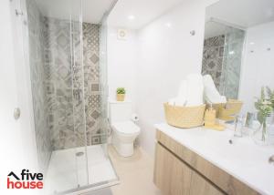 a white bathroom with a shower and a toilet at FIVE HOUSE 16 in Porto +13 photos