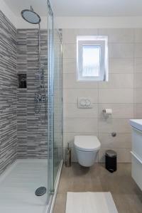 Kúpeľňa v ubytovaní Apartmani Utmar Cres