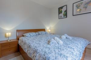 Posteľ alebo postele v izbe v ubytovaní Apartmani Utmar Cres