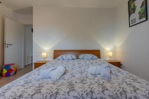 Posteľ alebo postele v izbe v ubytovaní Apartmani Utmar Cres
