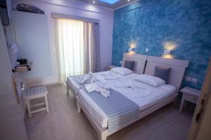 Кровать или кровати в номере Villa Bel Passo Apartments