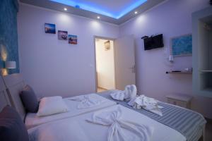 Кровать или кровати в номере Villa Bel Passo Apartments