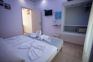 Кровать или кровати в номере Villa Bel Passo Apartments