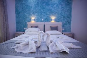 Кровать или кровати в номере Villa Bel Passo Apartments