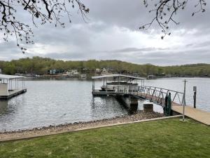a dock on a body of water at Loft , boat dock, 2 bedrooms , pet friendly in Gravois Mills