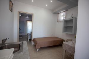 Кровать или кровати в номере Villa Bel Passo Apartments