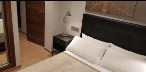 Łóżko lub łóżka w pokoju w obiekcie Apartamento Miguel Angel