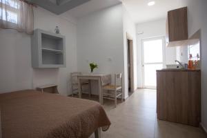Кухня или мини-кухня в Villa Bel Passo Apartments
