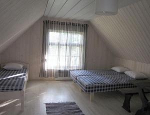 Postelja oz. postelje v sobi nastanitve Mandjala Puhketalu - Cottages
