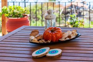 a plate of food with an pumpkin and mushrooms on a table at Thea Studios in Pyrgadikia