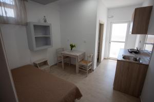 Кухня или мини-кухня в Villa Bel Passo Apartments
