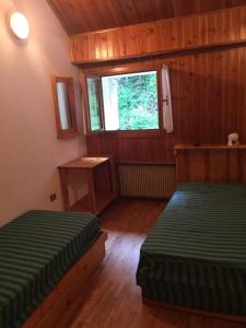 Ένα ή περισσότερα κρεβάτια σε δωμάτιο στο Casa Marina presso residence Camporosso