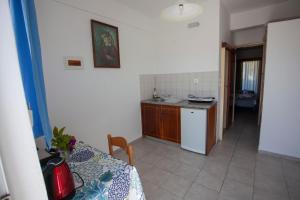 Кухня или мини-кухня в Villa Bel Passo Apartments
