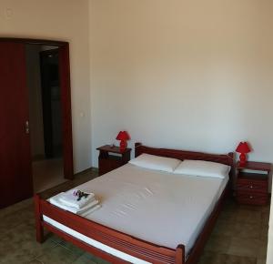 Postel nebo postele na pokoji v ubytování Dora Apartments