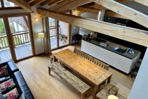an overhead view of a living room with a wooden table at Chalet Of 235 M2 With Balcony Garden In Chamonix in Chamonix