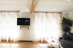 Телевизор и/или развлекательный центр в Saint Etienne : appartement Châteaucreux 40 M2