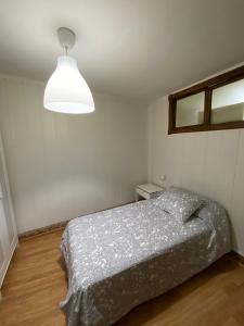 Łóżko lub łóżka w pokoju w obiekcie Rúa Real 40, 1