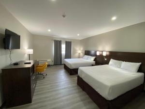 Postel nebo postele na pokoji v ubytování Econo Lodge