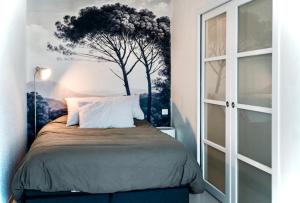 Кровать или кровати в номере L’ Appart du Golf